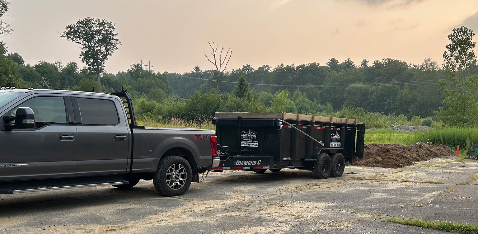 Dump trailer delivering dirt, Hometown Haul & Dump, junk removal, onsite junk removal, driveway safe dumpsters, dump trailer
